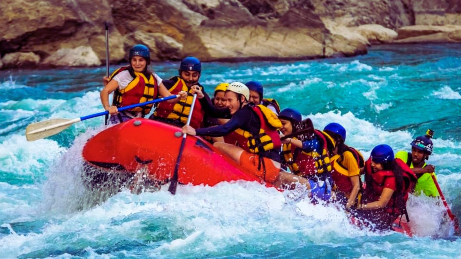 A group of people enjoying a rafting adventure on a river, surrounded by lush greenery and clear blue skies.