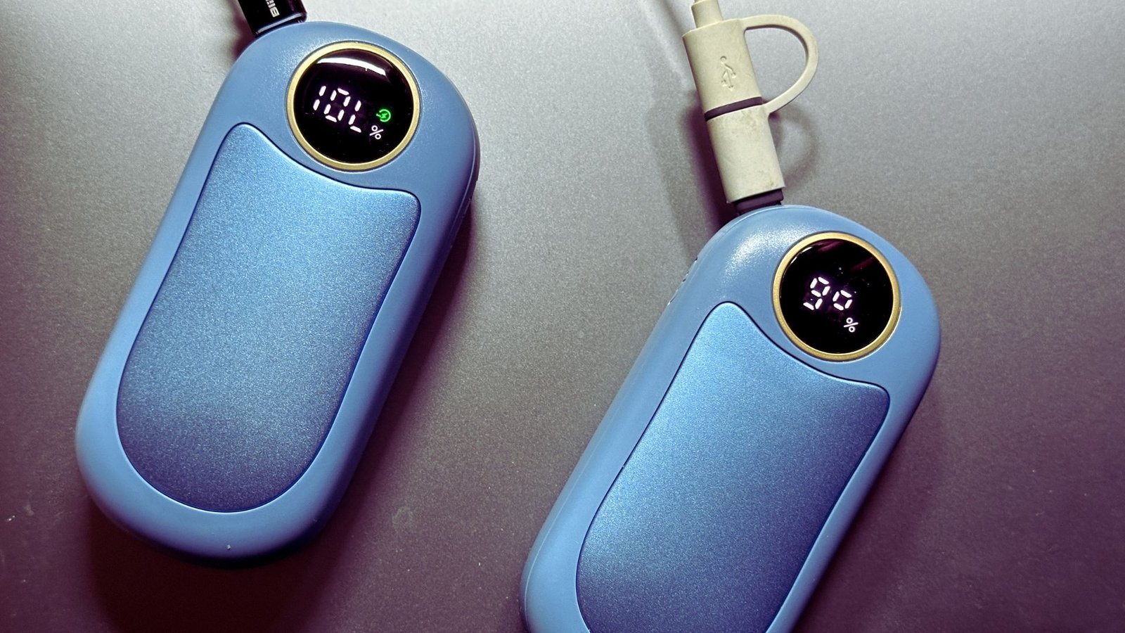 Two blue electronic devices are displayed side by side on a white background.