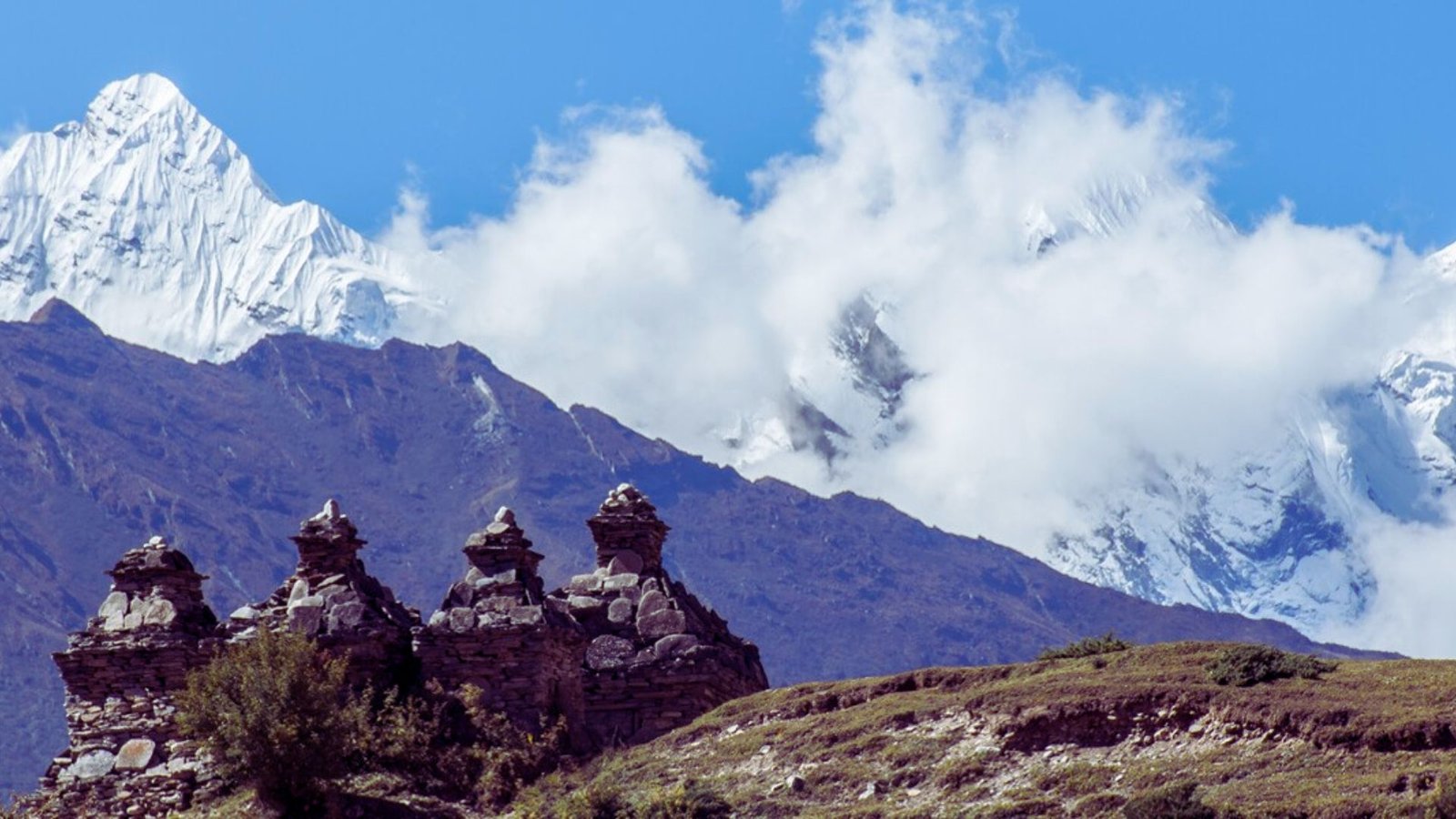 Snow-covered peaks of mountains dominate the background, adding beauty to the landscape.
