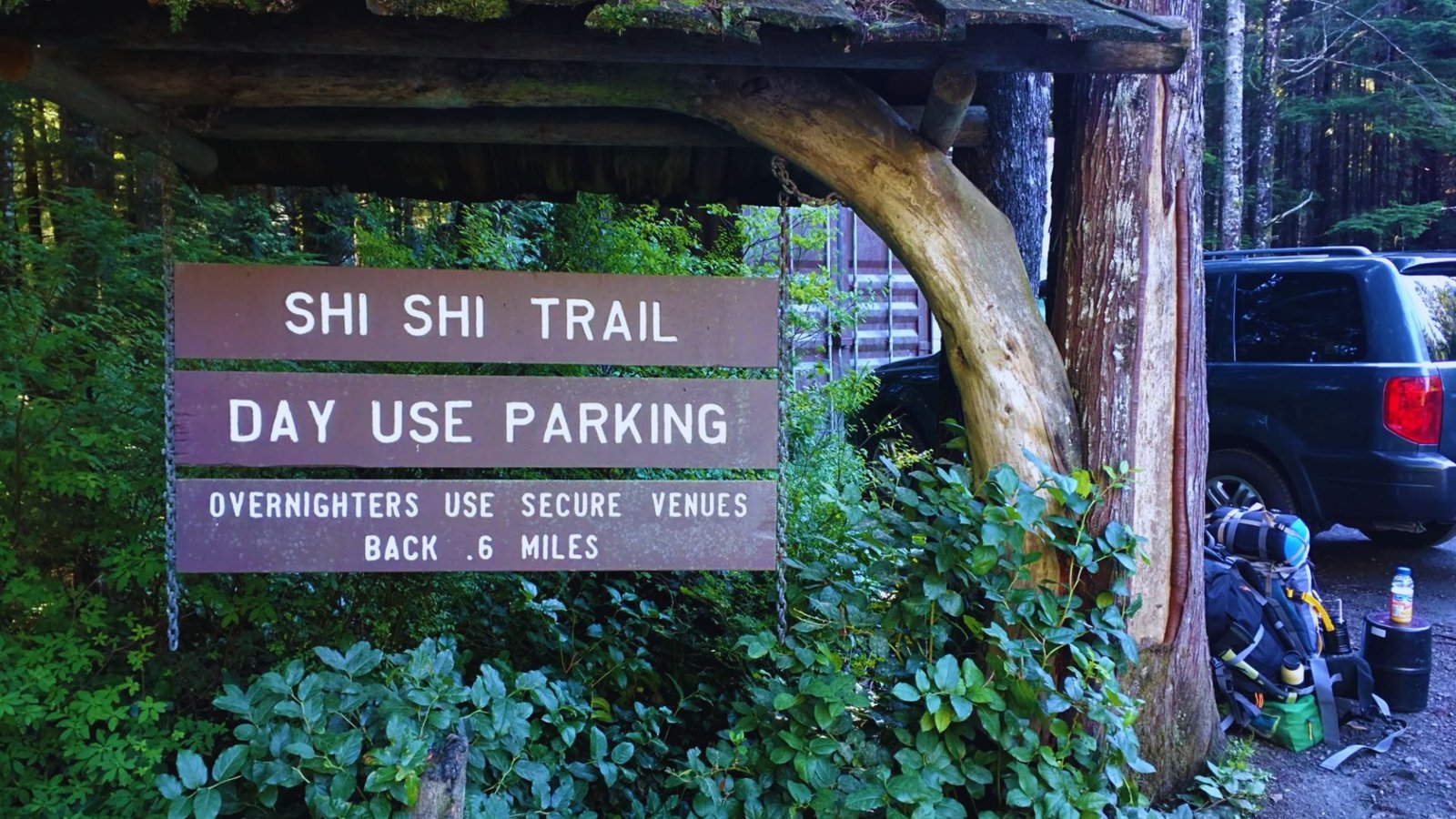 Sign indicating Shi Shi Beach Trail day use parking area.
