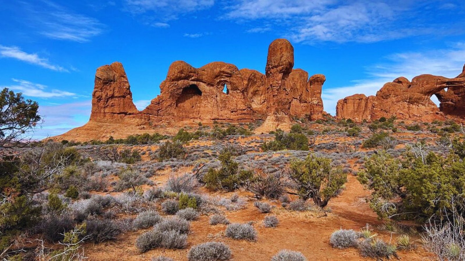 Scenic view of Arches National Park in Utah, showcasing its iconic red rock formations and natural arches.
