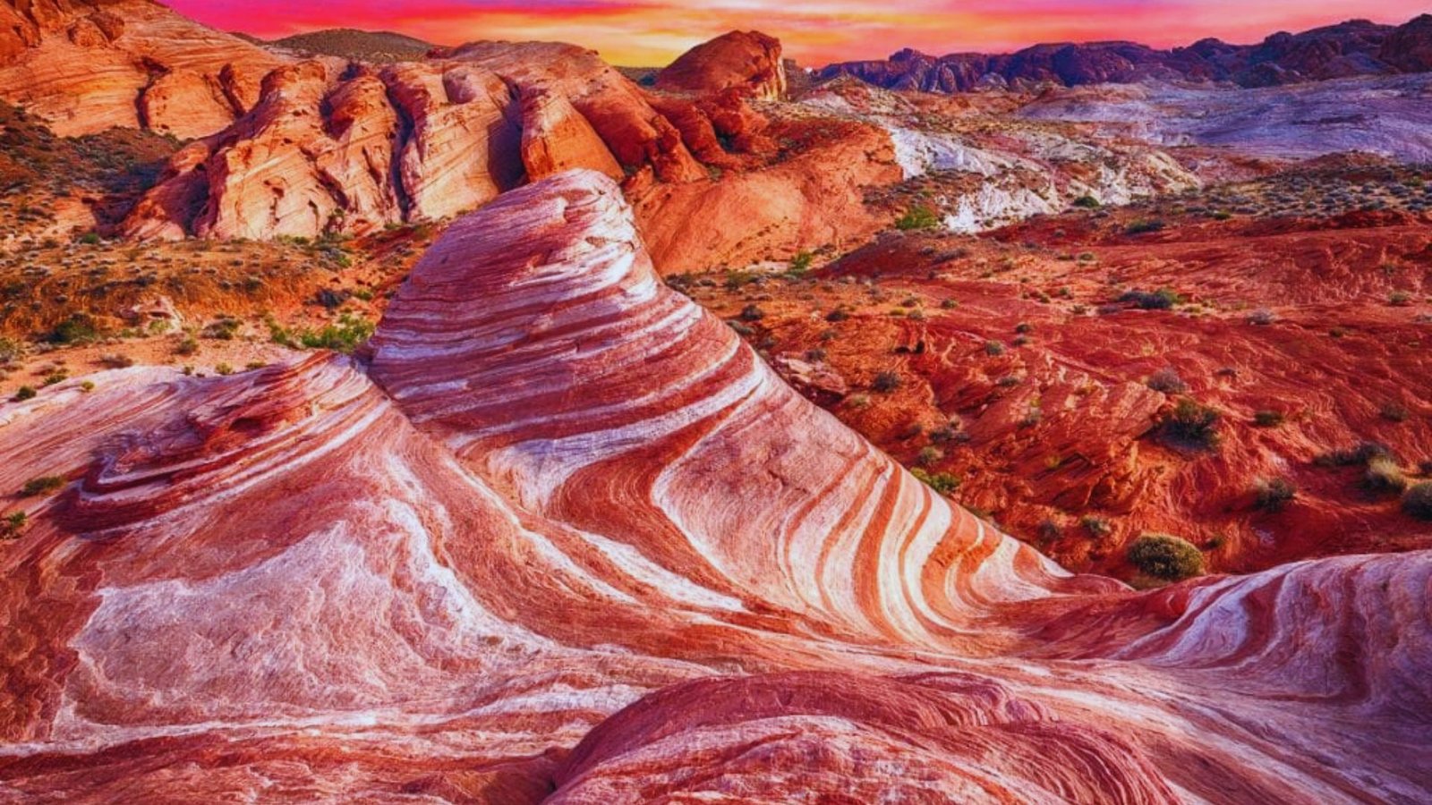Red rock formations in Valley of Fire, Nevada, showcasing vibrant colors and new geological features ideal for hiking.
