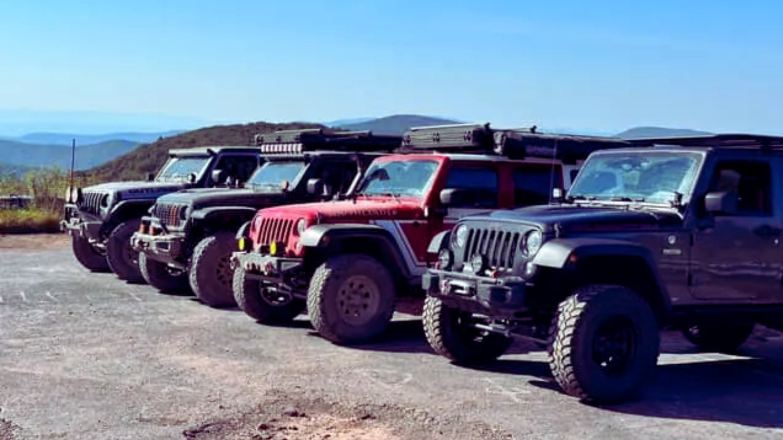 Jeep Wrangler JK 4x4 parked on a rugged terrain, showcasing its off-road capabilities and distinctive design.